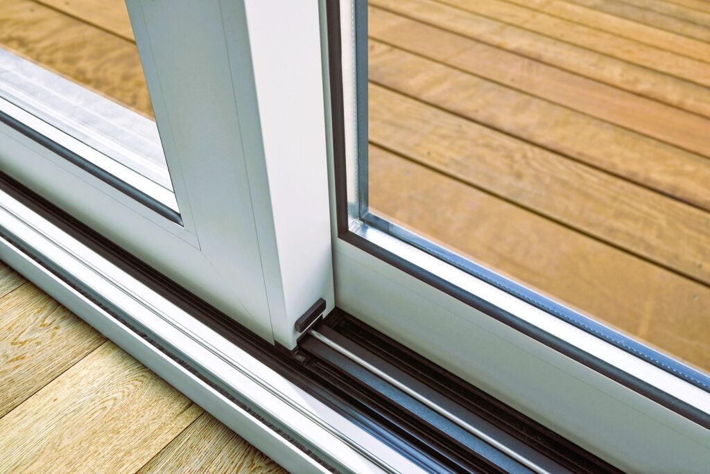 Sliding glass door detail and rail embed in floor