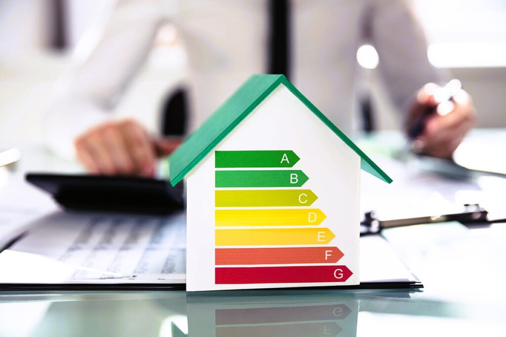 Close-up Of House Model Showing Energy Efficiency Rate